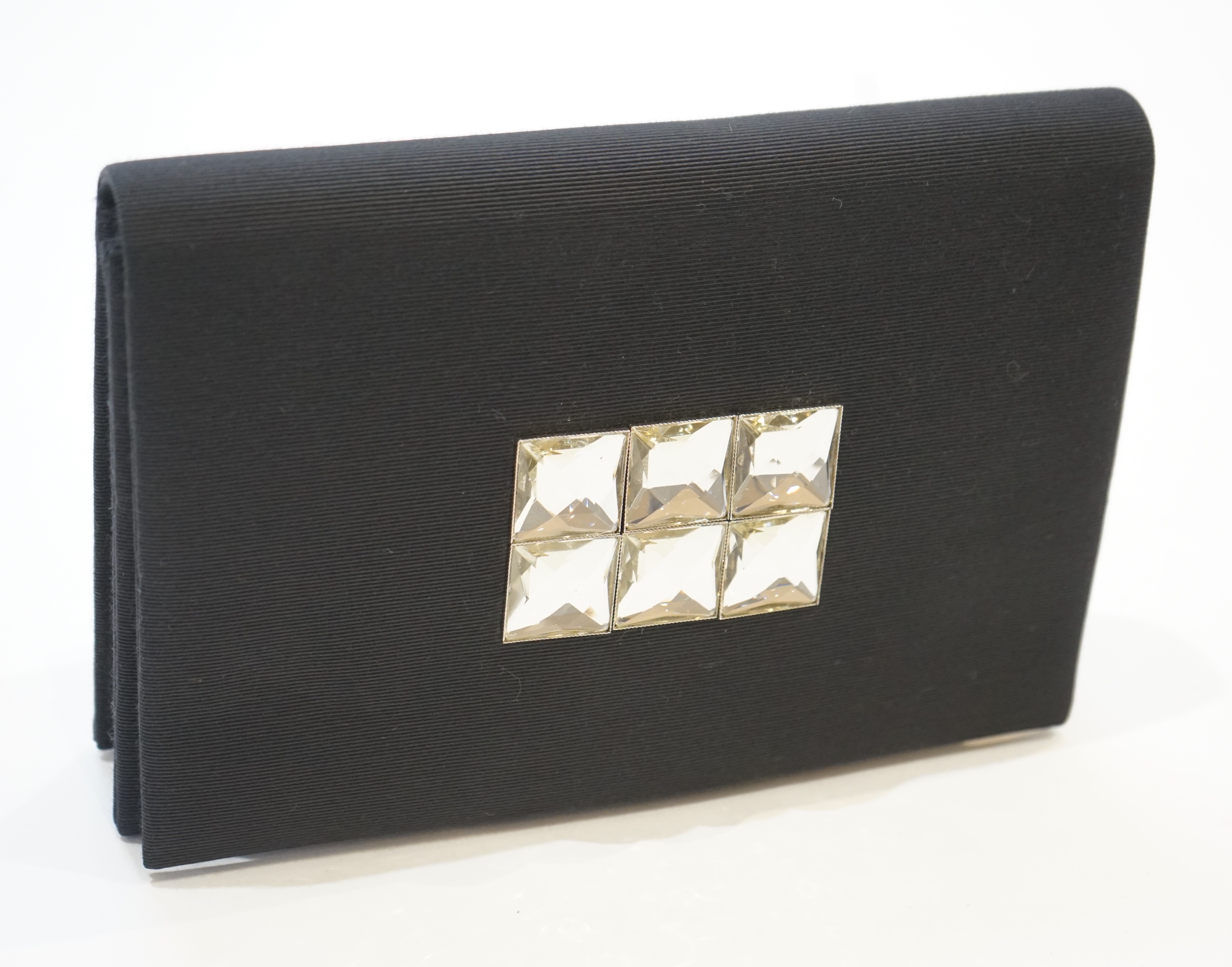 A vintage Yves Saint Laurent black silk satin clutch bag 25 cm.